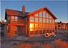 Third view - View of house from the beach with large deck patio with built in firepit and patio furniture.