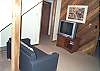 Lower level - Sitting room with small couch and TV.  Fifth bedroom features a custom built Double size bunk bed (no photo) on lower level.