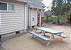 Side yard with picnic table.