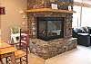 Lower level - Beautiful gas fireplace that can be viewed from both the living room and the dining/kitchen area.