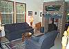 Second view - Lower level - Living room with wood stove.