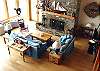 Lower level - Large living room with flat screen TV/DVD, wood burning fireplace, and sitting area with telescope.  Spectacular ocean views!
