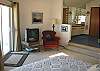 Second view - Middle level - Large master bedroom with Queen bed, TV//VCR/DVD, ocean view and slider to large west facing deck. Private bathroom with shower and a large walk-in closet.