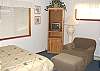 Second view - Master bedroom with a Queen bed and TV.