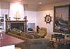 Lower level - Living room with TV/VCR/DVD and wood burning fireplace.  Spectacular ocean front views.