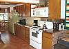 Fully equipped kitchen with breakfast table for 6 and a breakfast bar for 2.