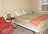 Master bedroom with Queen bed and short twin bed, TV, ocean views and 1/2 Bath