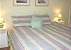 Lower level bedroom with a King bed.