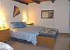 Upper level - Master bedroom with a Queen bed and TV with a private bathroom with a Jacuzzi tub and large shower.