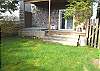 Fenced backyard with Hot tub and deck.