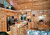 Fully equipped kitchen with gas cook stove and breakfast bar for 3