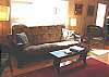 Living room with futon for extra sleeping, TV/VCR/DVD.