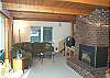 Lower level - Living room with large sectional with hide a bed for additional sleeping, Tv/VCR/DVD and gas fireplace.