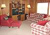Second view - Main level - Living room with TV/VCR/DVD, wood burning fireplace, CD player plus some games & books for your enjoyment.