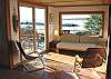 Sitting area just off the living room with two sliders out to the deck and spectacular ocean/bay views.