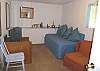 Lower level - Family room with couch that doubles as a Twin bed with TV/VCR.
