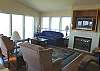 Second view - Living room with TV/DVD, gas fireplace and hide a bed for additional sleep with spectacular ocean views.