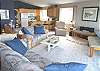 Second View - Upper level - Living room with hide-a-bed, dining for 5 and slider to large deck.