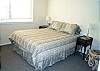 Master bedroom with a King bed and private bathroom with tub and shower.