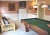Downstairs family room with Pool Table, Wet Bar, Fridge, TV/DVD, Darts, CD Player, futon for additional sleeping and Door to back Patio - The Garage also has a Ping Pong table