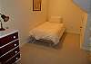 Second view - Upper level - Bedroom with a Twin bed, a Twin futon bed and a toddler bed.
