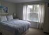 Upper level - Bedroom with Queen bed and private bathroom with tub and shower.