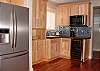 Fully equipped kitchen with wine fridge.