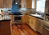 Fully equipped Kitchen with stainless steel appliances and Breakfast bar for 3.