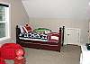 Third View - Upper level - Bedroom with two twin beds and flat screen TV.