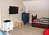Upper level - Bedroom with two twin beds and flat screen TV.