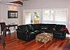 Downstairs Living room with Flat Screen TV and gas fireplace.