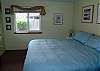 Lower level bedroom with a King bed.