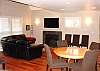 Downstairs Living room with Flat Screen TV and gas fireplace.