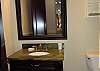 Another 1/2 bath located off of the living room/dining and kitchen areas.