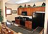 This kitchen is well-equipped with everything you need to cook a meal away from home.
