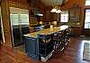 Kitchen has 2 sinks, 2 dishwashers and stainless appliances