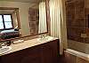 Master bath complete with double sinks, tile and plenty of linens