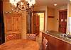 As you leave the master bedroom, the living area is off to the left, kitchen to the right, guest bath straight ahead and guest bedroom to the left of bath