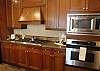 Any cook will enjoy cooking a meal in this gourmet kitchen with granite countertops, high-end appliances, and all the essentials to cook away from home.