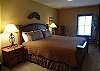 Enjoy a great night's sleep on this king sized bed. The master bedroom also features a flatscreen TV with Blu Ray Player, private bathroom, and sitting area.