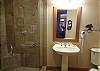 Pedestal Sink and surround tile shower