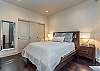 Master suite has a queen bed, plentiful dresser clothes storage and closet hanging space.