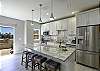 Kitchen featuring stunning countertops and ample space