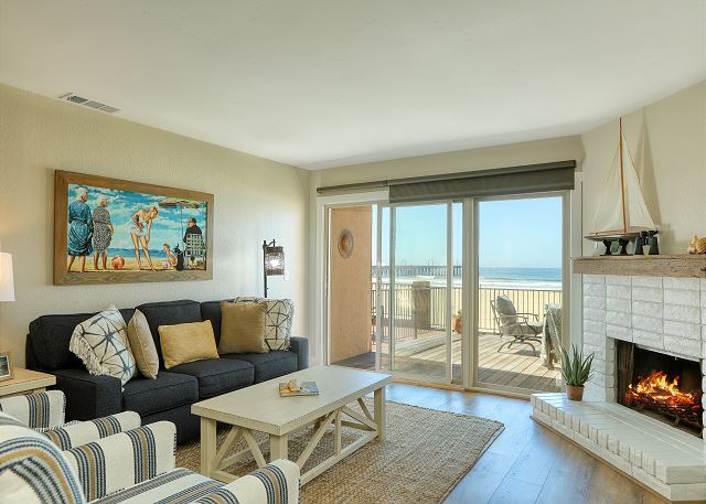 Enjoy uninterrupted white water views from the living room. Please be aware that the fireplace is not functional, but you can stay cozy with the patio fire table, perfect for taking the edge off the cool Pacific Ocean breeze.