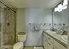 Master ensuite offers a spacious walk-in shower and double vanity sink.