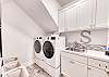 A utility room with large washer and dryer.