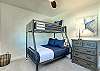 The third bedroom offers a fun and functional space for guests of all ages with a versatile twin-over-full bunk bed. 