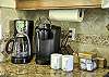 Kitchen furnished with a coffee maker and Keurig. A few coffee pods and sugar included.