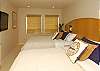 Guest bedroom with two queen beds.