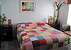 Master bedroom with queen size bed.